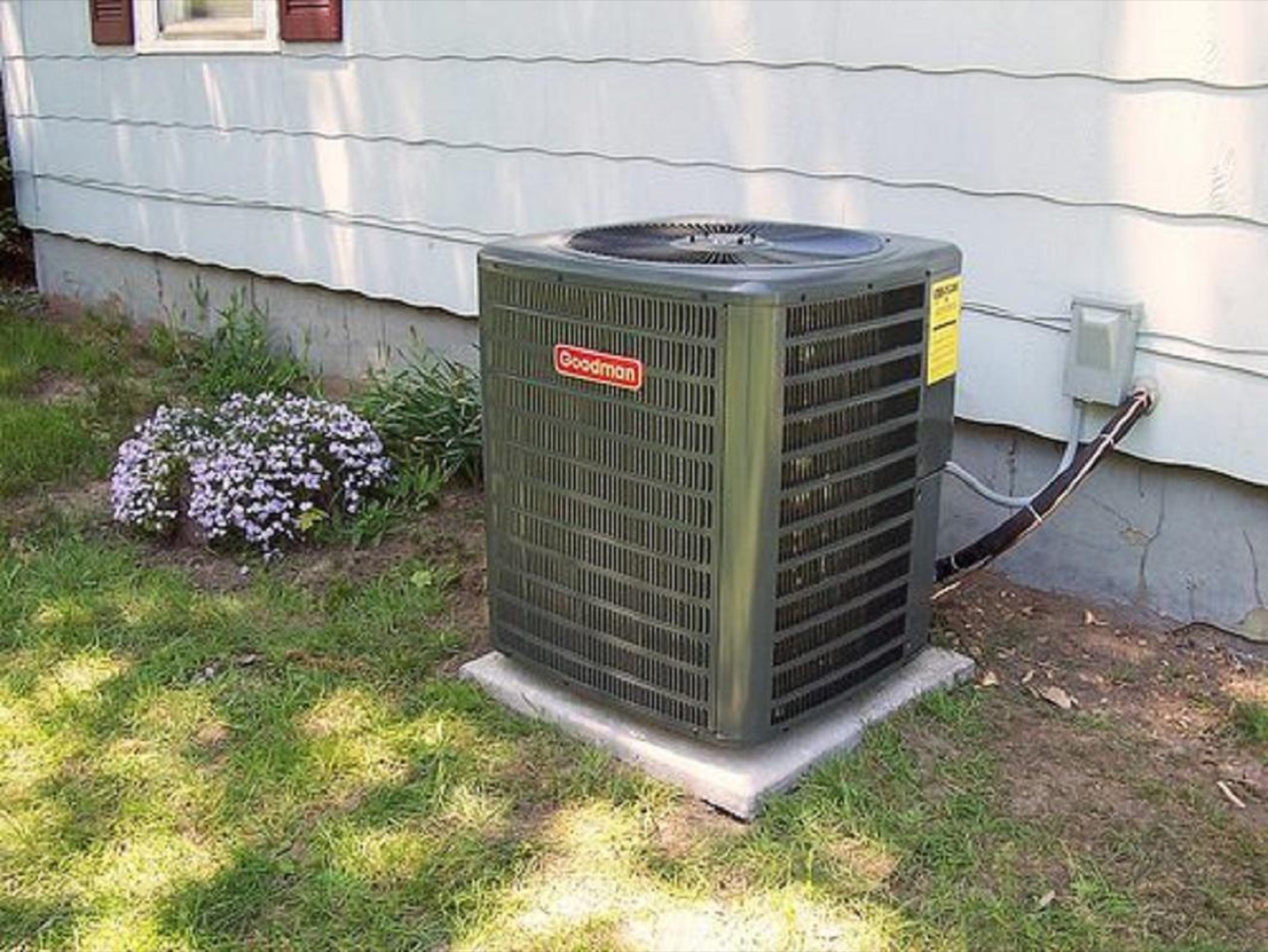 New Goodman air conditioning condenser installed beside a South Jersey home