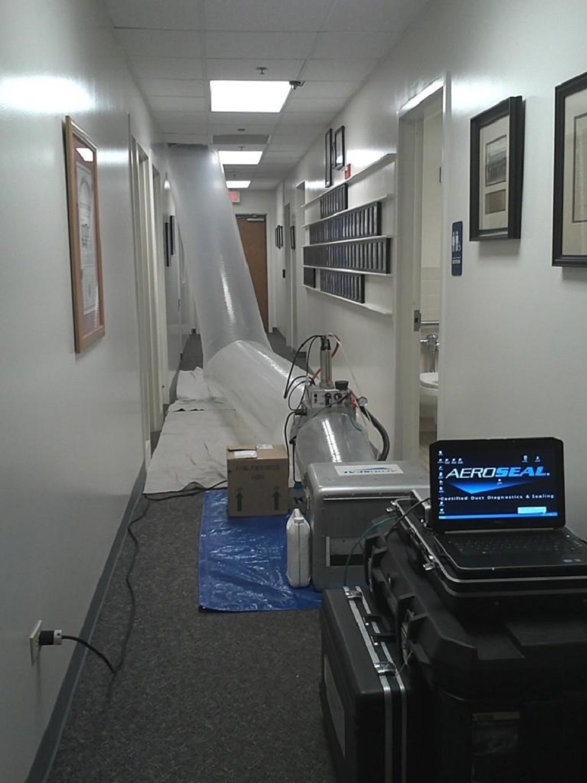 Aeroseal certified duct-sealing job in progress in a commercial hallway