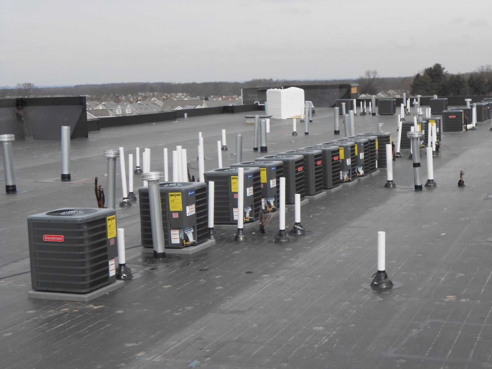 Row of Goodman commercial rooftop units on a South Jersey building