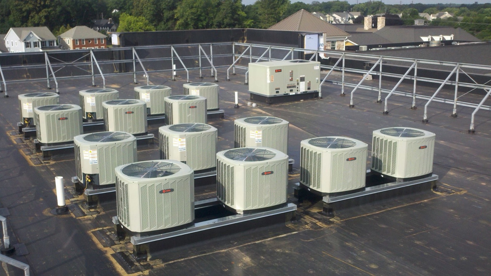 Array of Trane commercial rooftop condensers installed by Climate Mechanics