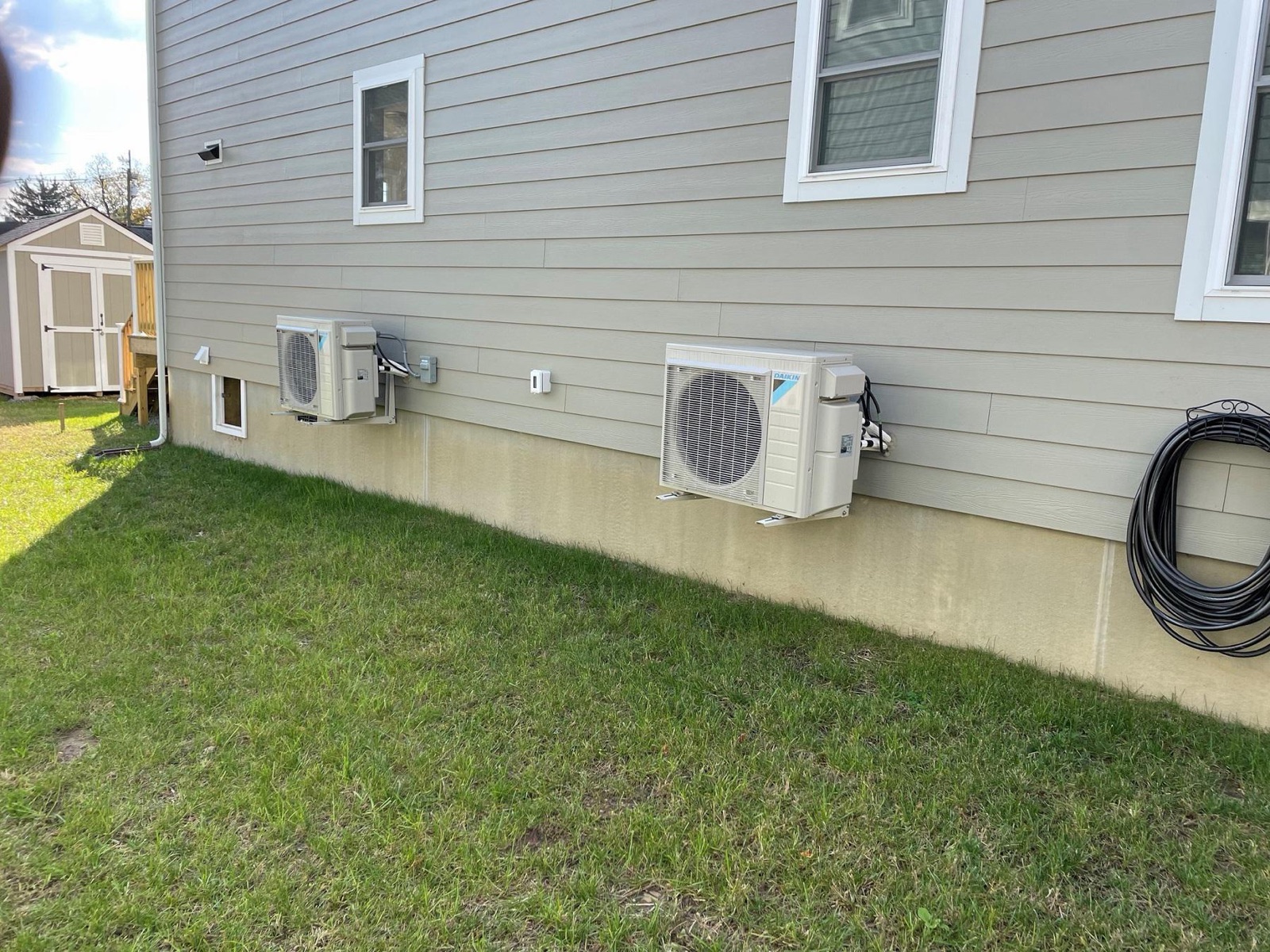 Two Daikin ductless mini-split condensers installed on a South Jersey home